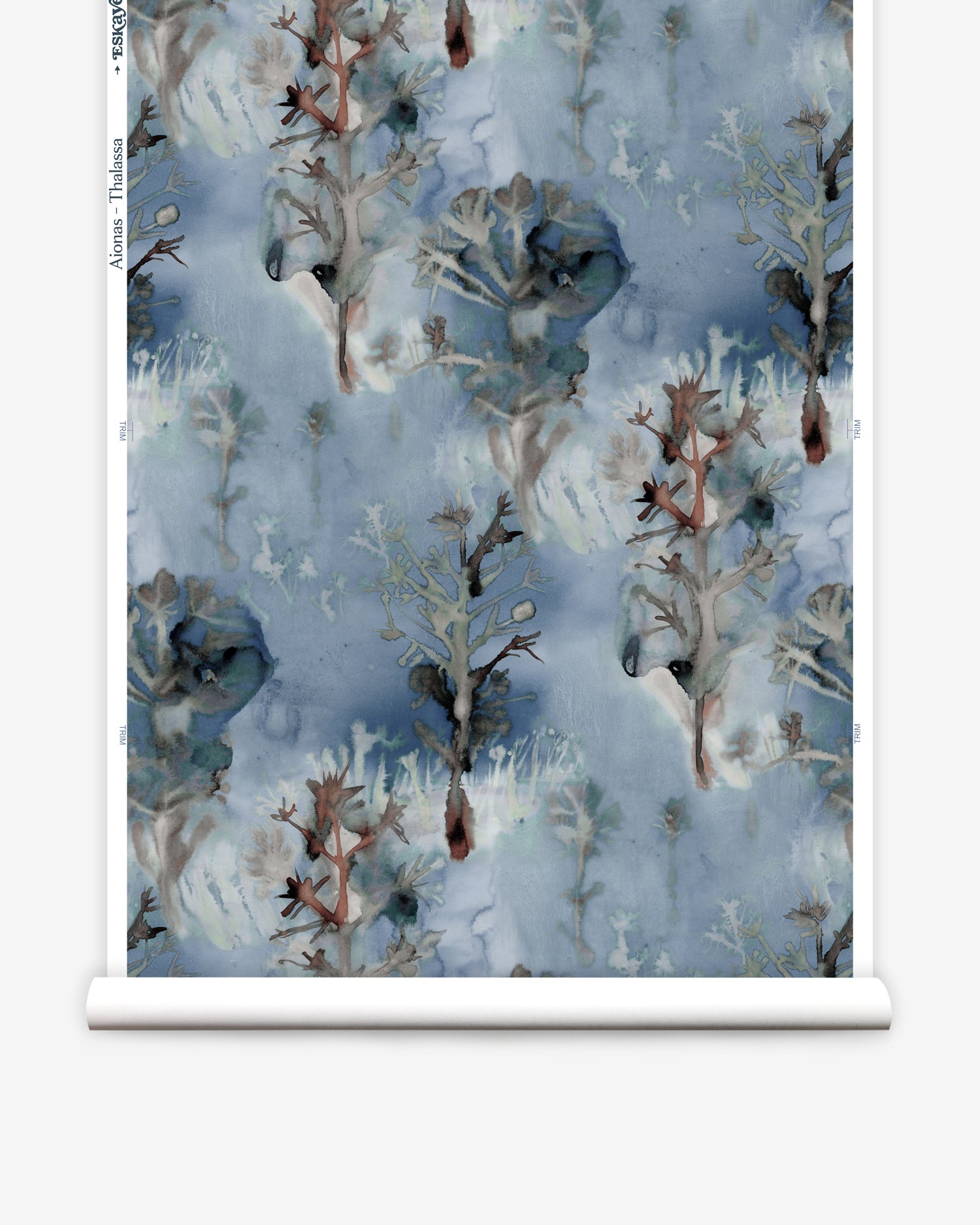 Wallpaper roll in a watercolor tree print in shades of gray and turquoise on a blue field.