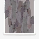 Wallpaper roll  in watercolor elongated pill pattern in moody purple on a white field.
