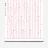 Wallpaper roll  in a painterly stripe print in light pink on a white field.