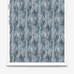 Draped fabric in a layered squiggle watercolor pattern in shades of steel blue. 