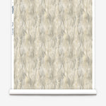 Wallpaper roll in a layered squiggle watercolor pattern in shades of grey and warn tan. 
