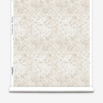 Wallpaper roll with beige watercolor floral pattern on a white background.