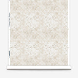 Wallpaper roll with beige watercolor floral pattern on a white background.