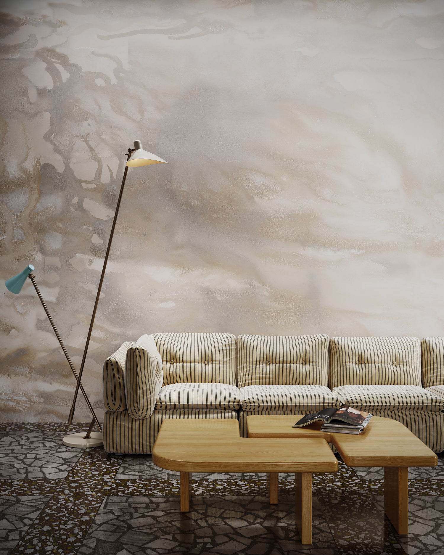 Striped couch, floor lamp and wooden coffee table against warm taupe watercolor mural wallpaper. 
