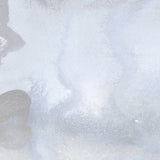 Mural wallpaper detail in an abstract textural watercolor design in pale grey blue. 
