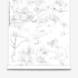 Wallpaper roll in a watercolor branch and floral pattern in soft grey on a white field