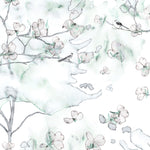 Wallpaper detail in a watercolor branch and floral pattern in teal green on a white field.