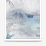Wallpaper roll of an ethereal watercolor mural in shades of blue and grey. 