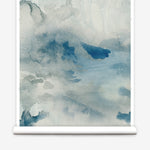 Wallpaper roll of an ethereal watercolor mural in shades teal, blue and soft grey. 