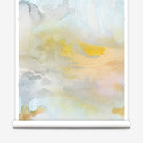 Wallpaper roll of an ethereal watercolor mural in shades of blue, green, yellow and grey. 