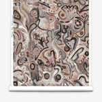 Wallpaper roll in abstract brushstroke design in shades of rust, tan and black accents. 