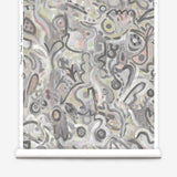 Wallpaper roll in abstract brushstroke design in shades of grey, tan and blush accents. 