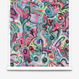 Wallpaper roll in abstract brushstroke design in shades of pink, turquoise, green, blue, yellow and black accents. 