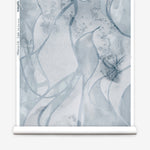 Wallpaper roll in abstract floral bushstroke design in soft slate blue. 