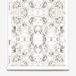 Wallpaper roll in a watercolor paint blotch print in purple and gray on a white field.