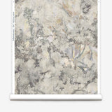 Wallpapper roll in a painterly tree print in gray, brown and purple.