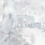 Detail of wallpaper mural in a minimal splatter print in shades of gray on a cream field.