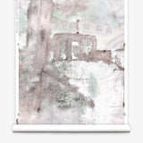 Wallpaper roll mural in a minimal splatter print in shades of gray and pink on a cream field.