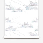 Wallpaper roll in a watercolor splatter print in pastel purple and gray on a cream field.