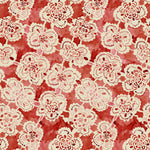 Pattern of white lace flowers on a red background
