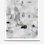 Wallpaper roll in a textural paint blotch print in shades of gray and blue on a light gray field.