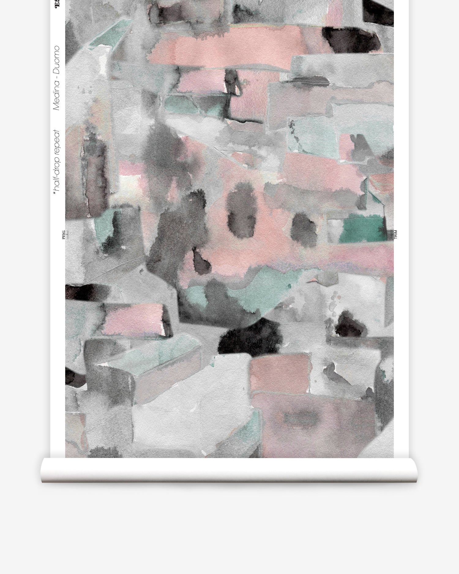 Wallpaper roll in a textural paint blotch print in shades of pink and gray on a white field.