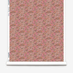 Wallpaper roll in an undulating abstract watercolor motif in pink, orange and grey. 