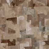 Wallpaper detail in a geometric puzzle piece watercolor pattern in brown and charcoal. 