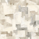 Wallpaper detail in a geometric puzzle piece watercolor pattern in beige and grey. 