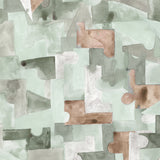 Wallpaper detail in a geometric puzzle piece watercolor pattern in sage green, grey ad brown. 