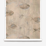 Wallpaper roll in an watercolor oceanic fish pattern in warm tan. 