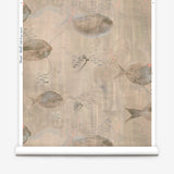 Wallpaper roll in an watercolor oceanic fish pattern in warm tan. 