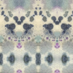 Wallpaper detail in a watercolor inkblot print in shades of blue and purple on a cream field.
