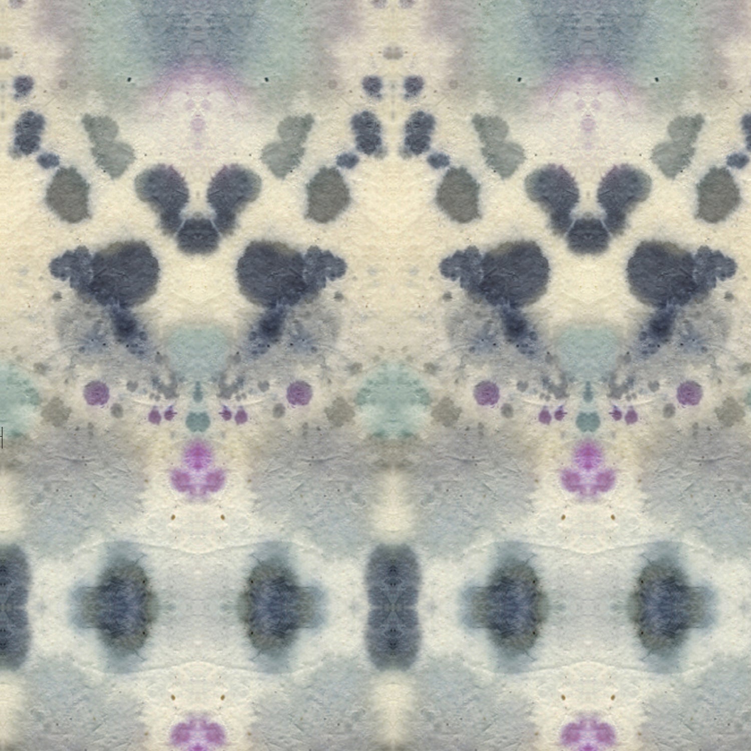 Wallpaper detail in a watercolor inkblot print in shades of blue and purple on a cream field.