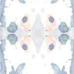Wallpaper detail in a watercolor ink splash print in shades of pastel blue and pink on a cream field.