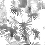 Wallpaper detail in an watercolor palm frond pattern in shades of grey.