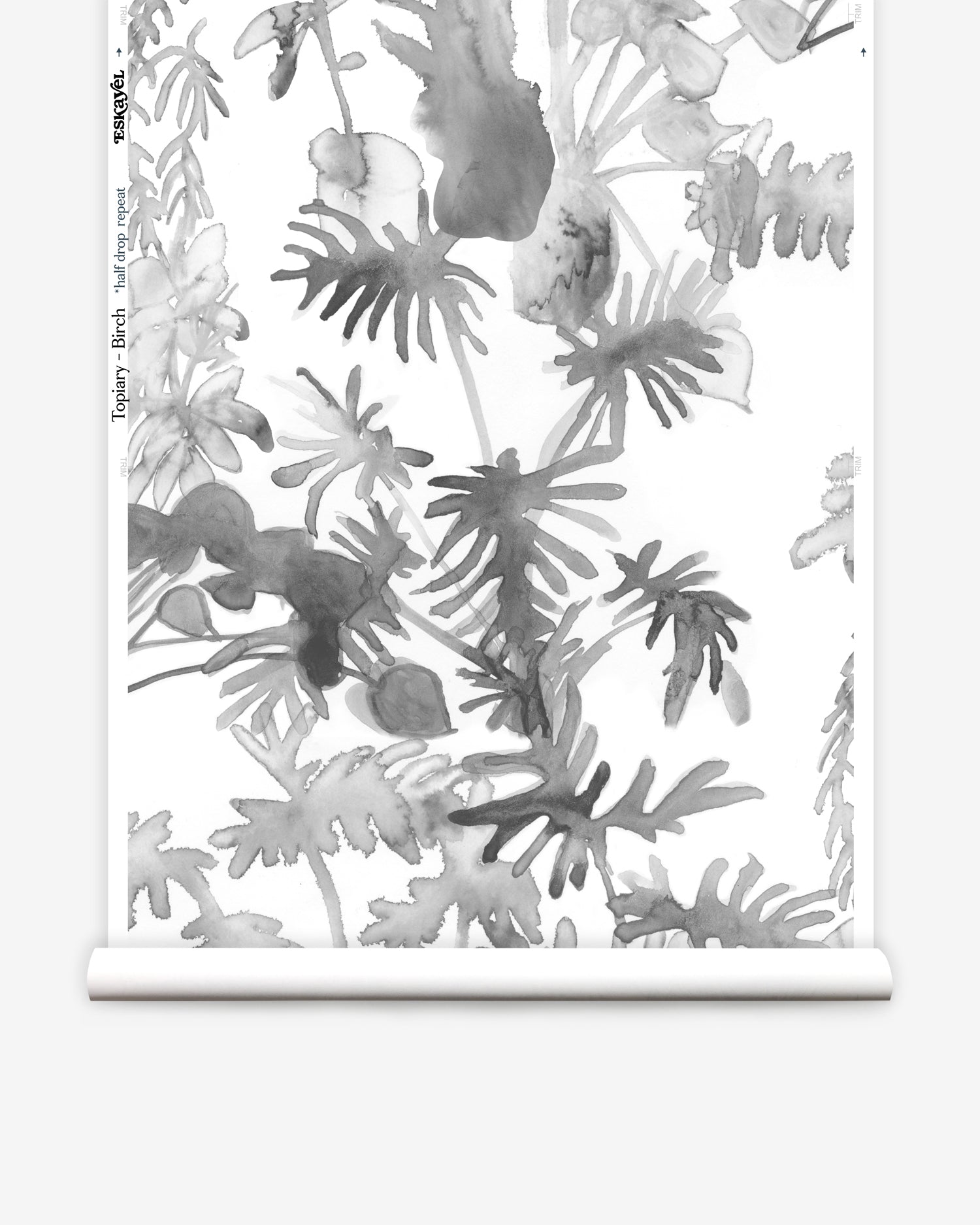 Wallpaper roll in an watercolor palm frond pattern in shades of grey.