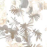 Wallpaper detail in an watercolor palm frond pattern in shades of beige and tan. 