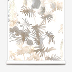 Wallpaper roll in an watercolor palm frond pattern in shades of beige and tan. 