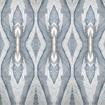 Wallpaper detail in a watercolor diamond print in shades of gray and navy on a cream field.