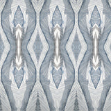 Wallpaper detail in a watercolor diamond print in shades of gray and navy on a cream field.
