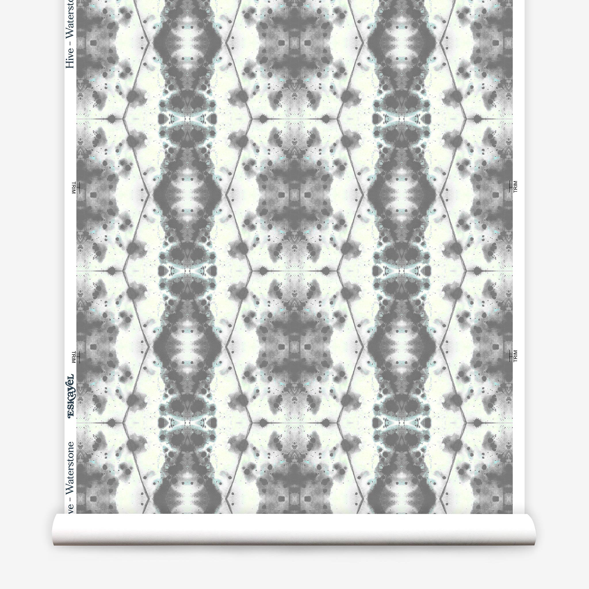 Partially unrolled wallpaper yardage in a painterly gometric stripe in gray and blue on a cream field.