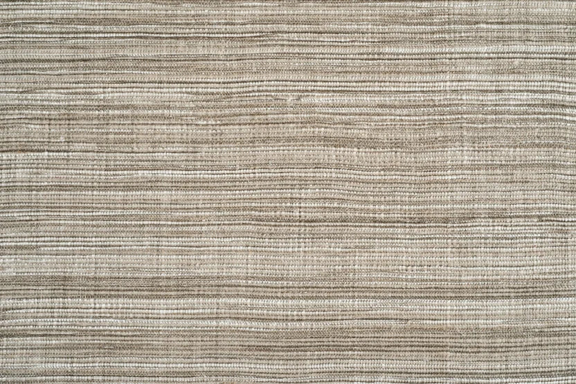 Broadloom carpet swatch in a textured pattern tan grey color