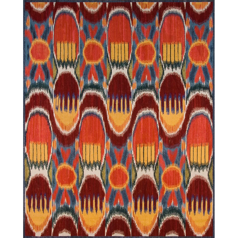 Ikat rug with red, orange, and blue colors on a white background