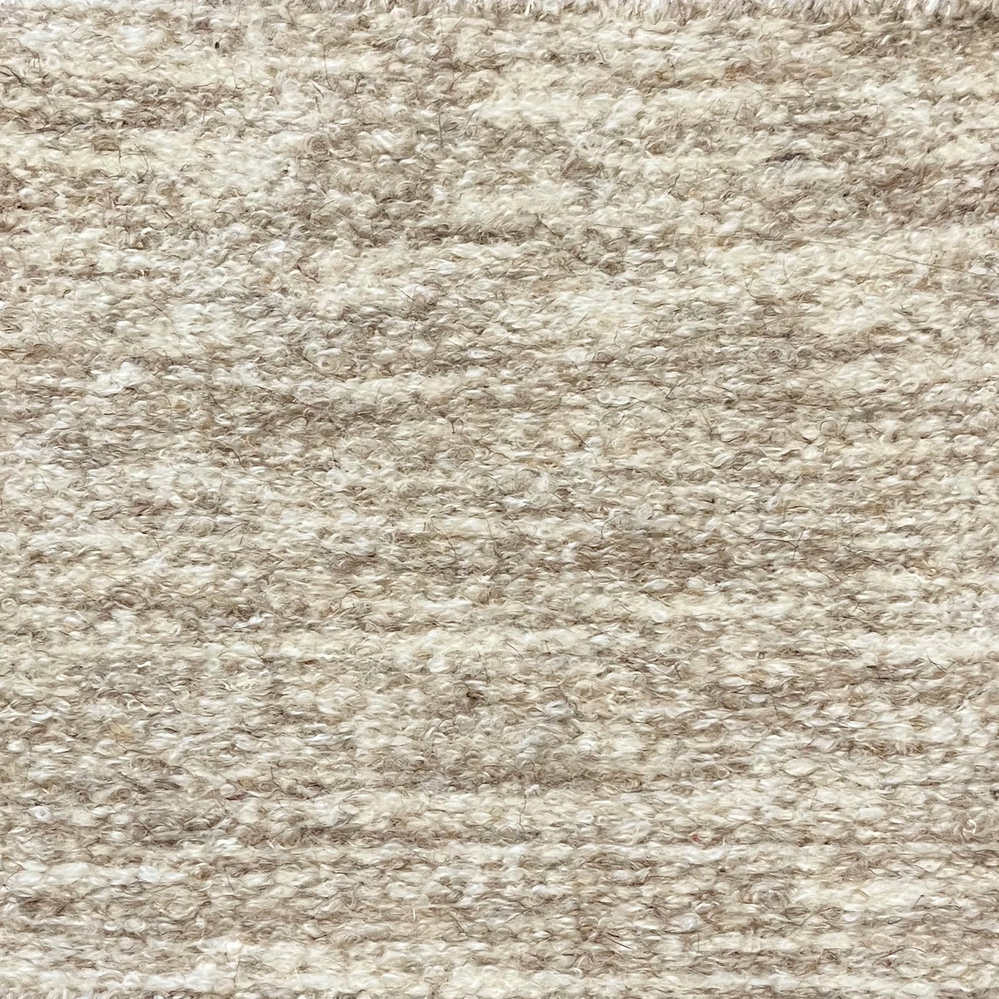 Textural bouclé broadloom carpet in oatmeal.