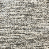 Textural bouclé broadloom carpet in heathered sage and white.