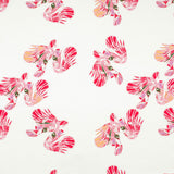 Detail of fabric in a playful feather print in pink, purple and orange on a cream field.