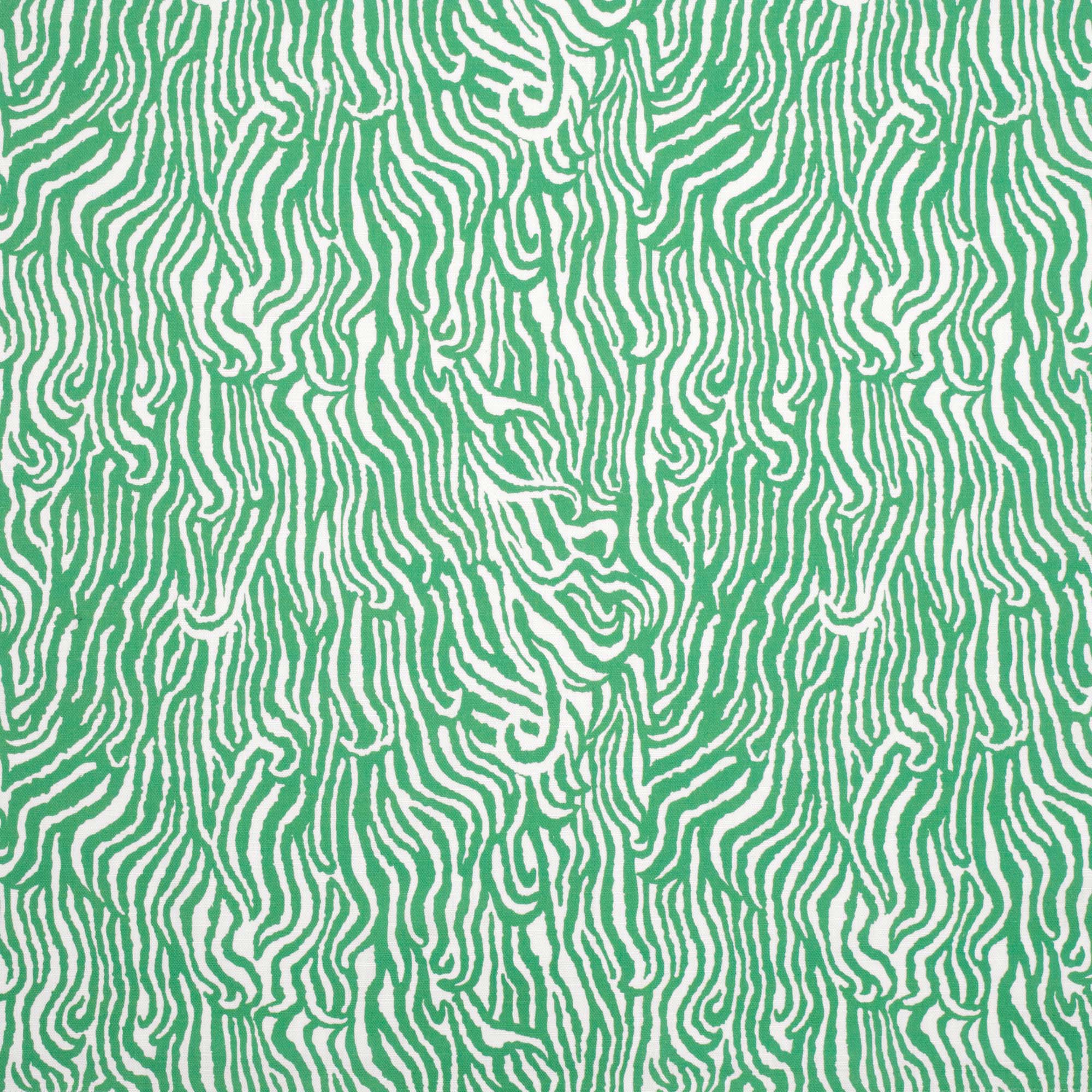 Detail of fabric in a playful animal print in light green on a white field.