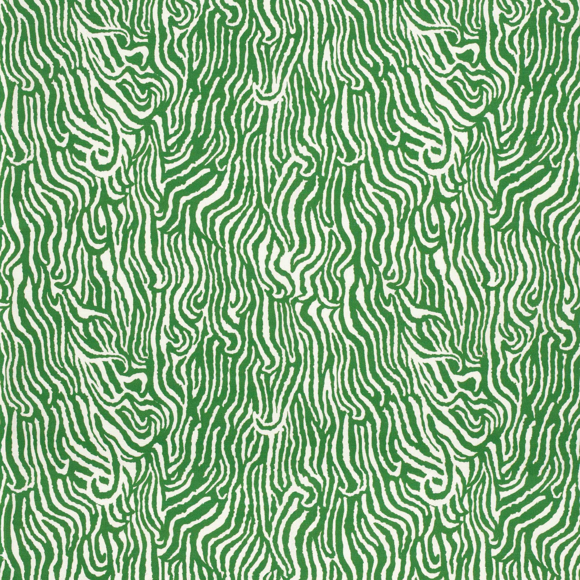 Detail of fabric in a playful animal print in green on a white field.