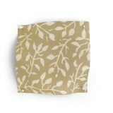 Fabric swatch with leaf pattern on a beige background